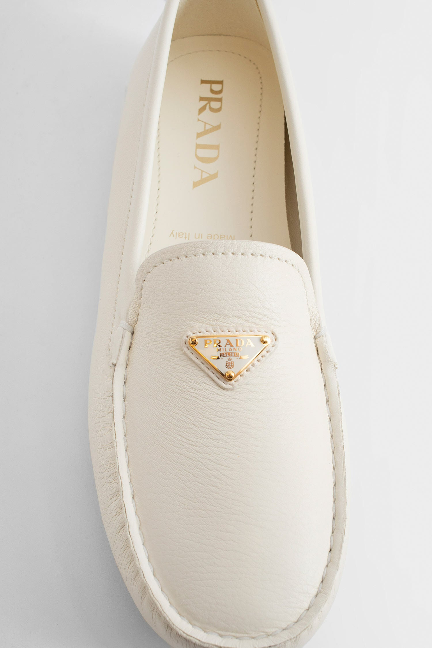 PRADA WOMAN OFF-WHITE LOAFERS