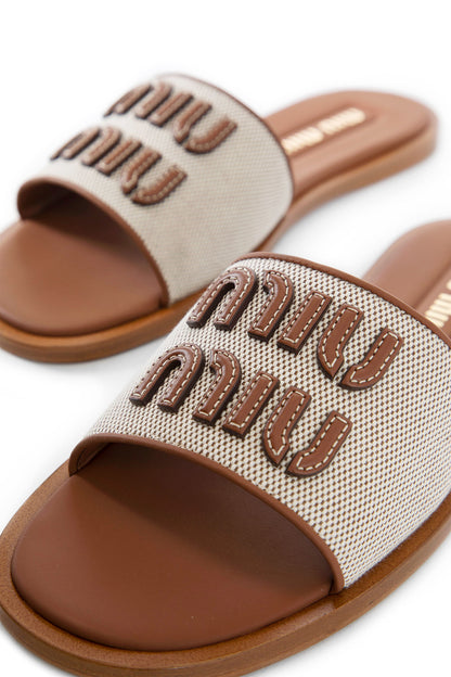 MIU MIU WOMAN BEIGE SANDALS & SLIDES