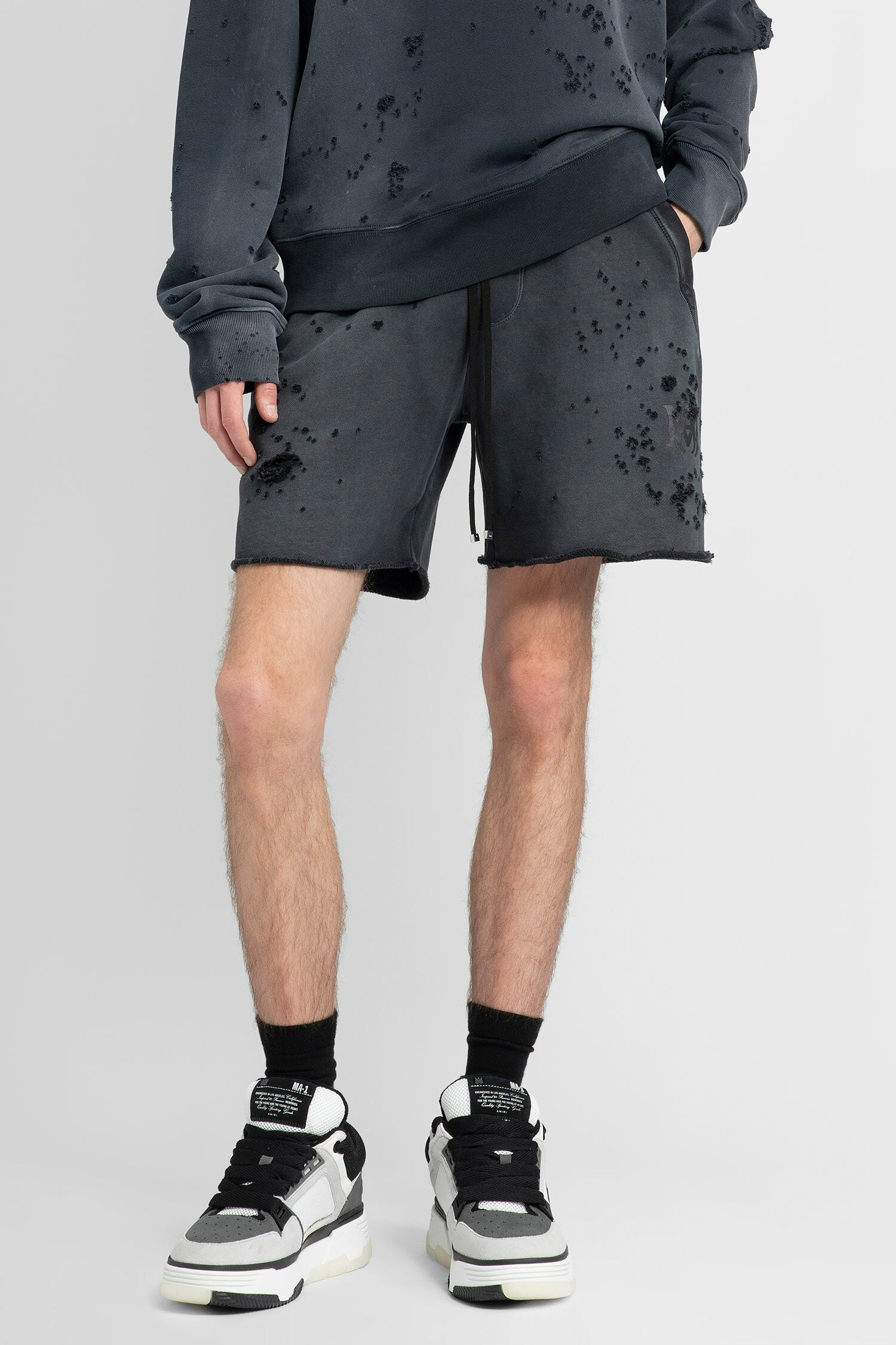 AMIRI MAN GREY SHORTS & SKIRTS