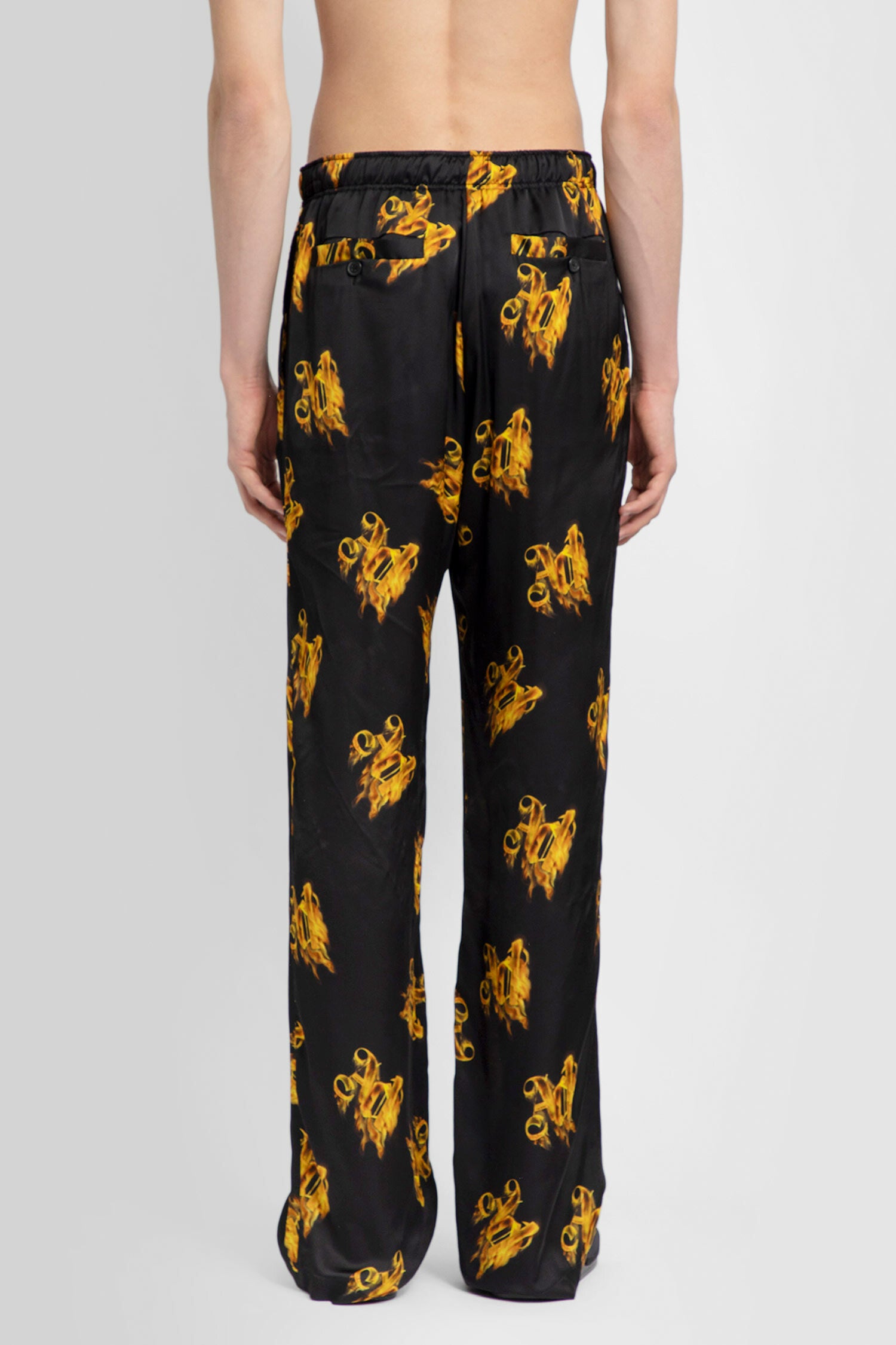 PALM ANGELS MAN BLACK TROUSERS