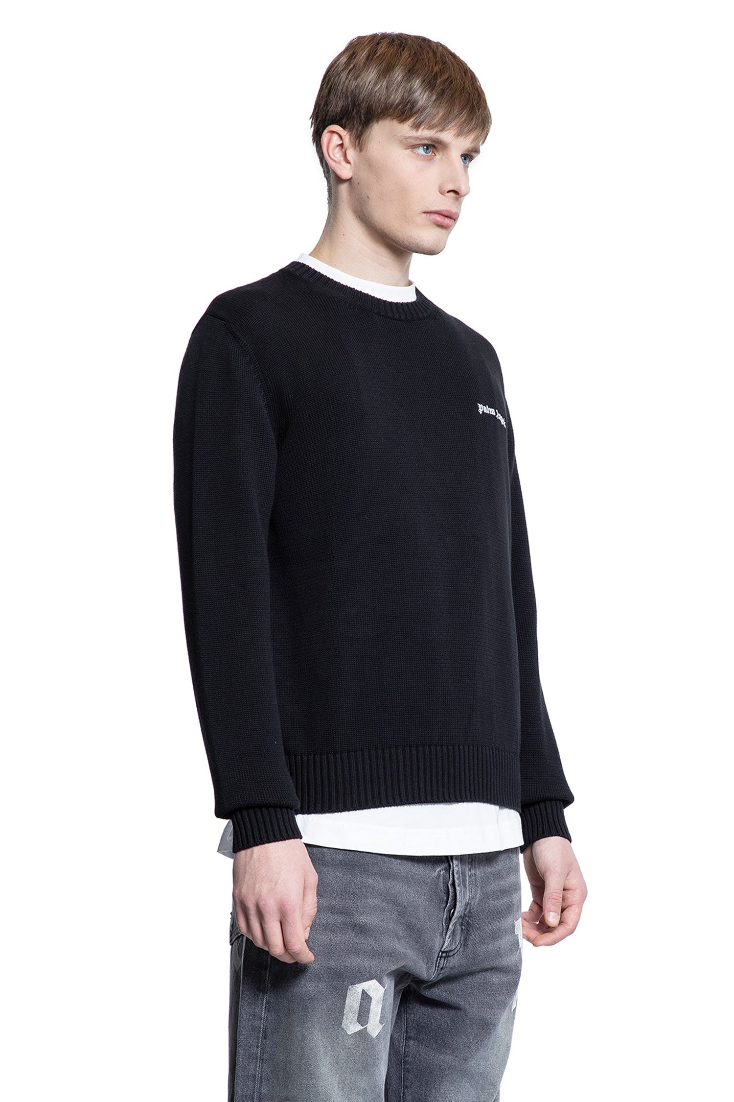 PALM ANGELS MAN BLACK KNITWEAR