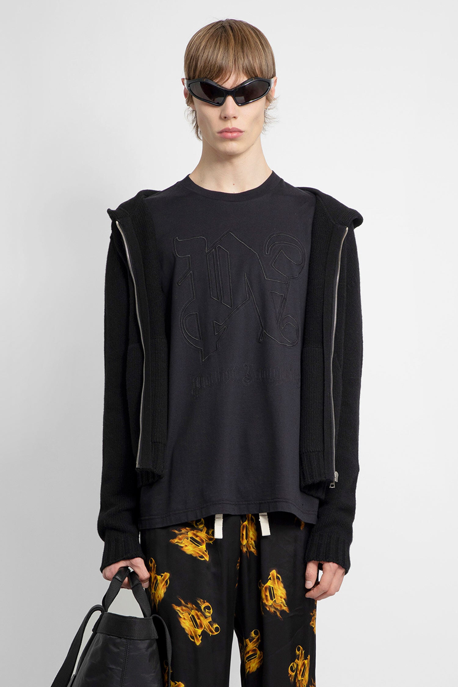 PALM ANGELS MAN BLACK KNITWEAR