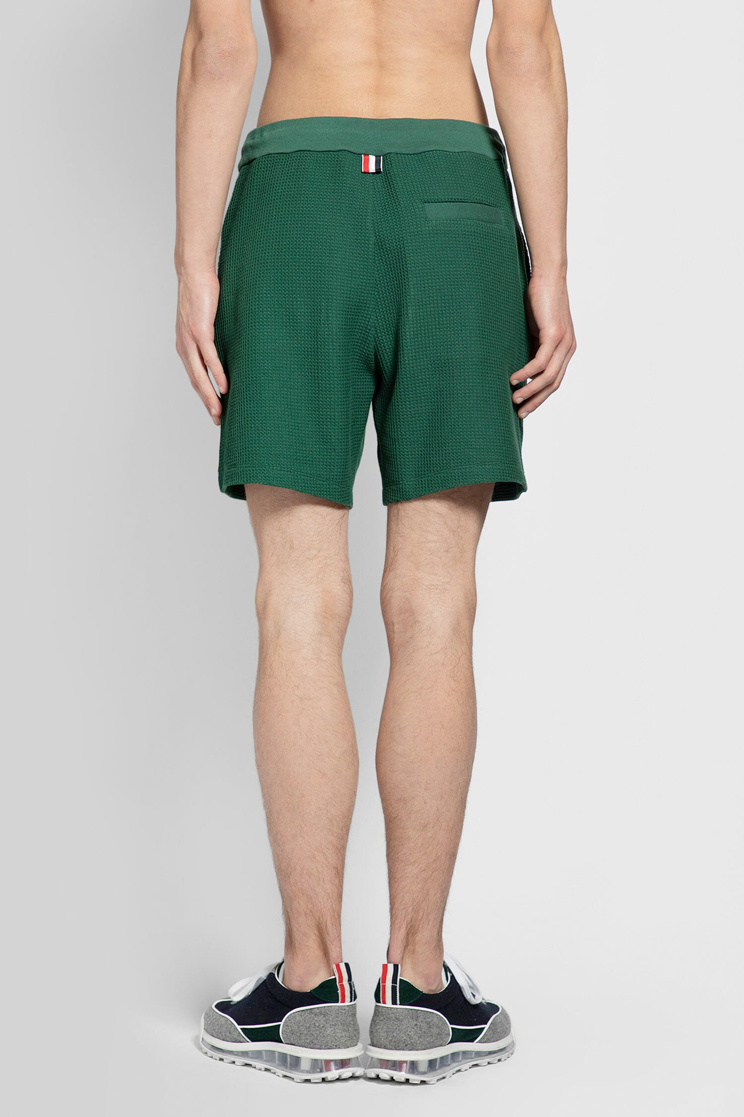 THOM BROWNE MAN GREEN SHORTS & SKIRTS