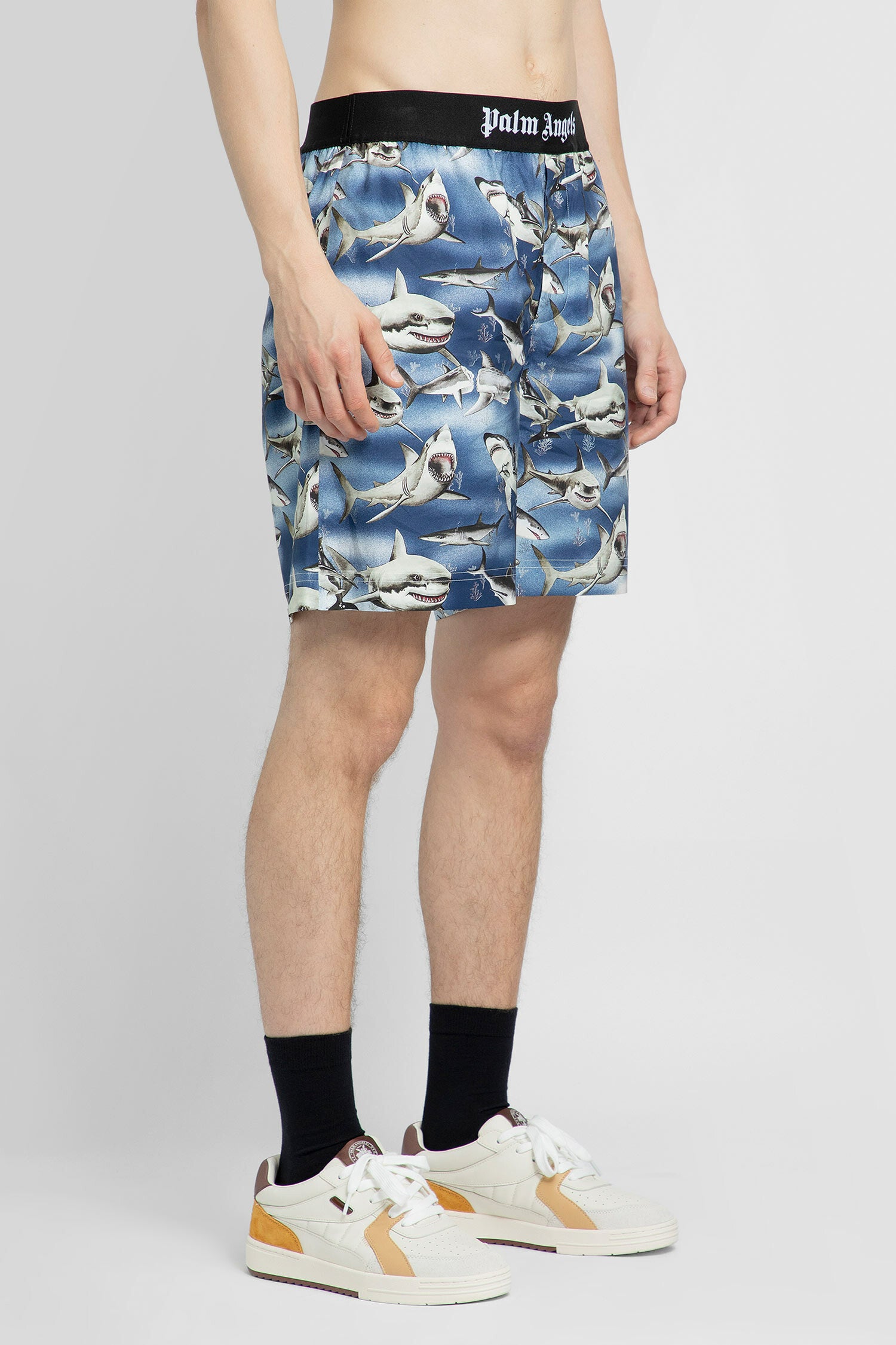 PALM ANGELS MAN BLUE SHORTS & SKIRTS