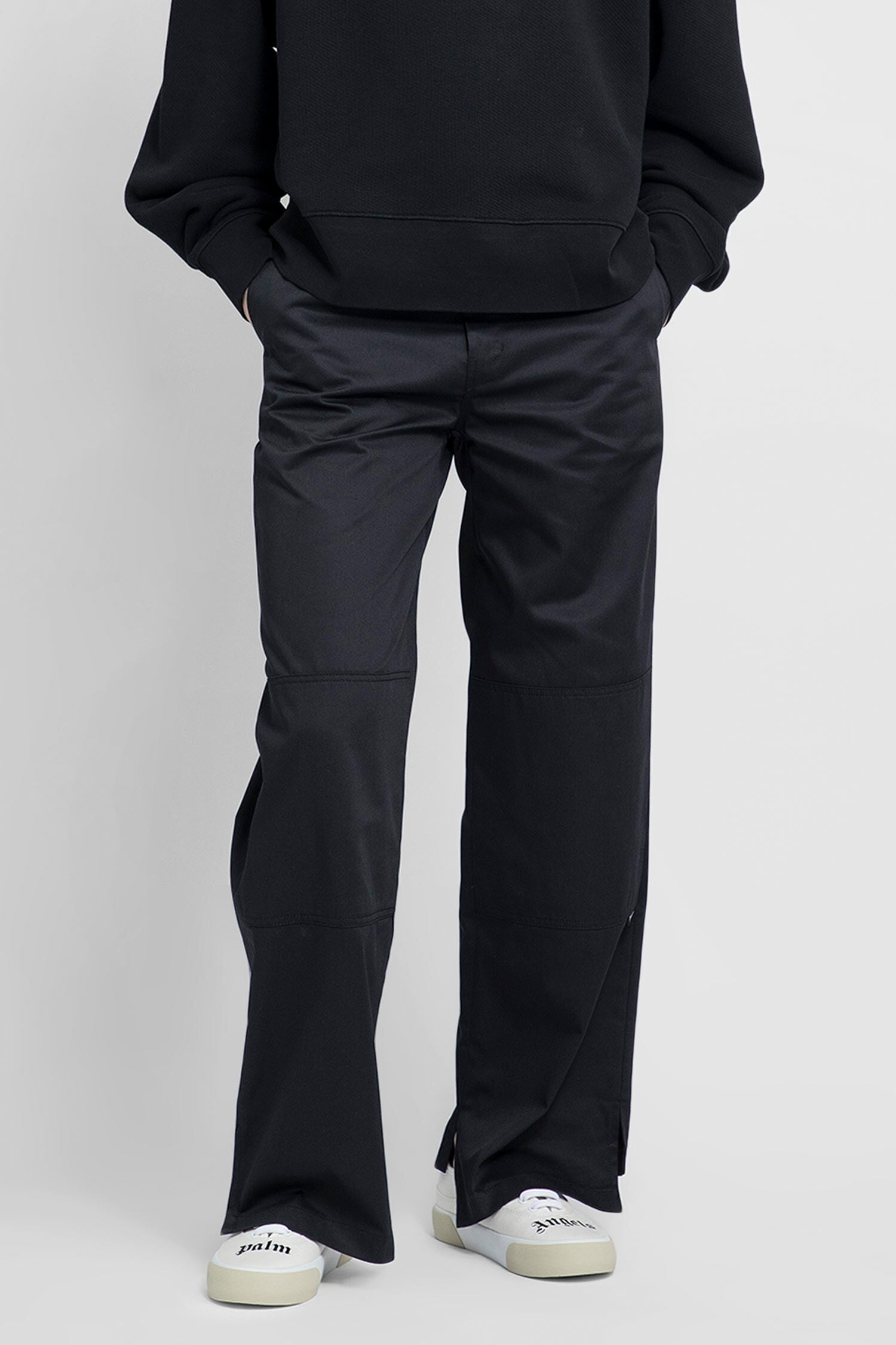 PALM ANGELS MAN BLACK TROUSERS