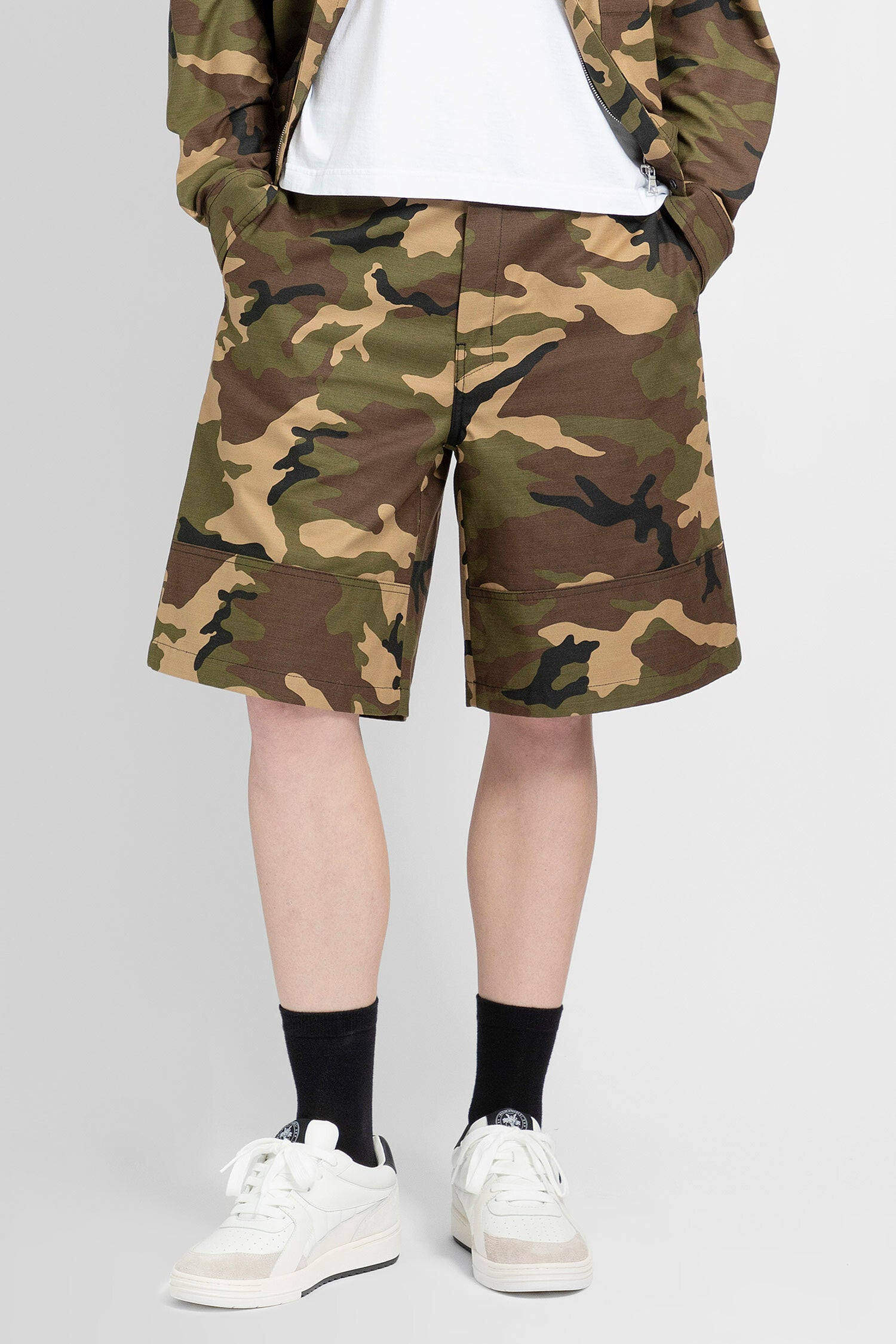 PALM ANGELS MAN GREEN SHORTS & SKIRTS