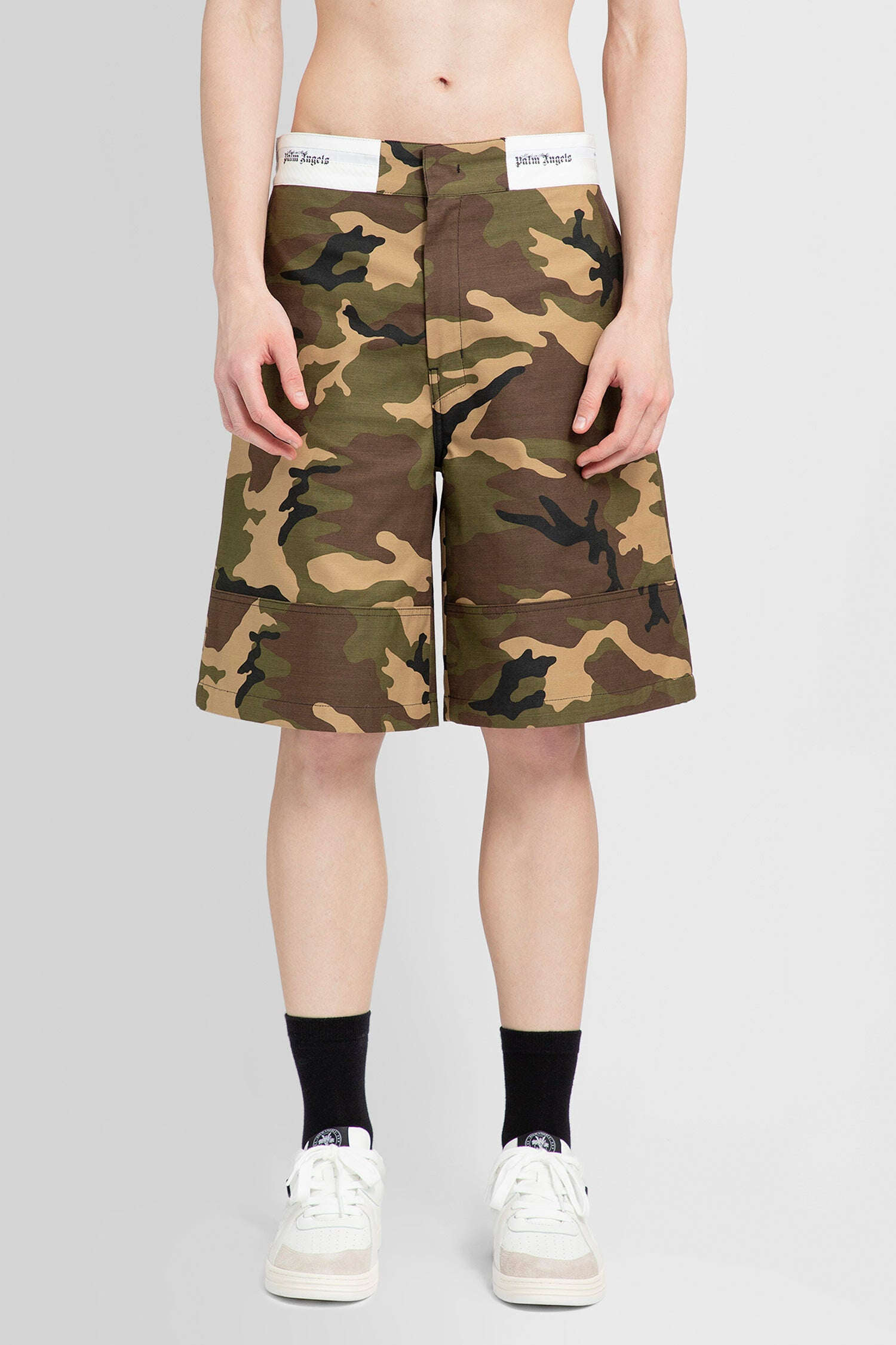 PALM ANGELS MAN GREEN SHORTS & SKIRTS