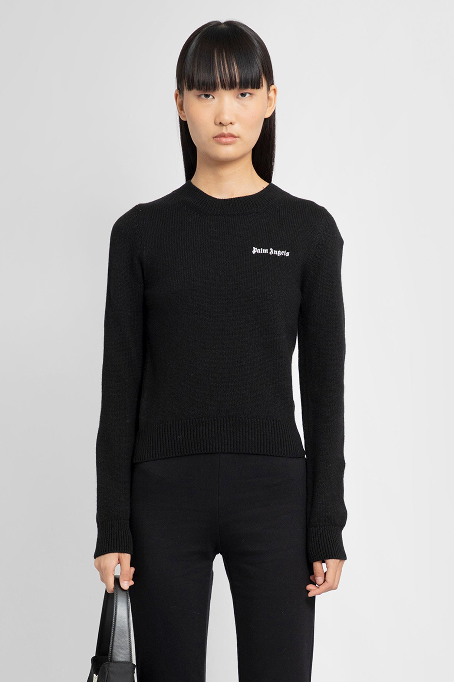 PALM ANGELS WOMAN BLACK KNITWEAR