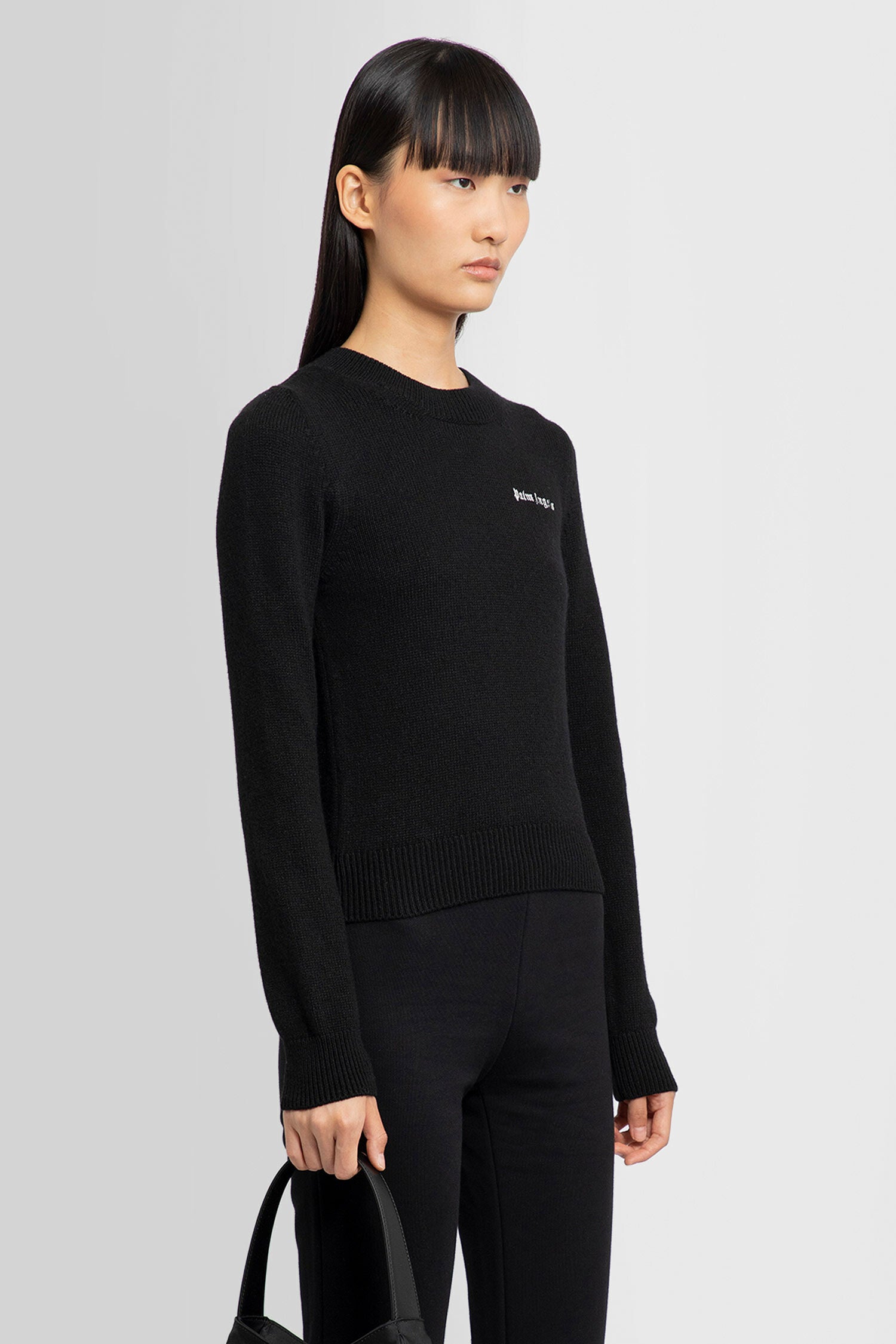 PALM ANGELS WOMAN BLACK KNITWEAR